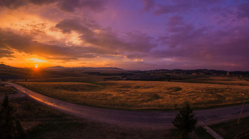 Scenic view of landscape against sky during sunset