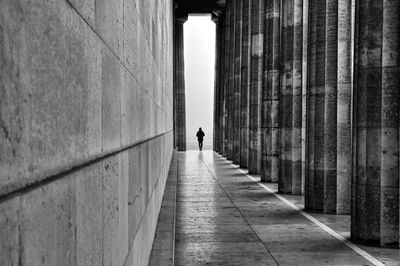 Rear view of person on corridor of old building