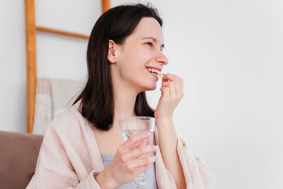 Young woman drinking water