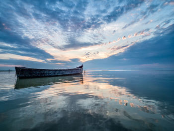 Scenic view of sea against sky at sunset