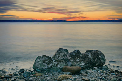 Scenic view of sea against sky during sunset