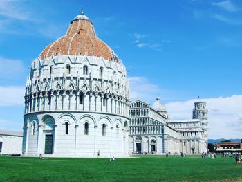 Pisa baptistry of st john against sky at piazza dei miracoli