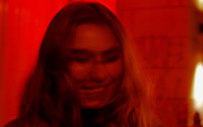 Close-up portrait of smiling young woman