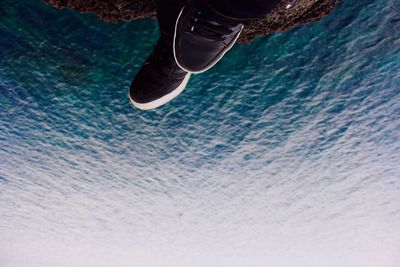 View of water splashing on blue sky