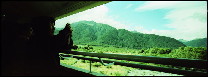 Scenic view of mountains seen through window