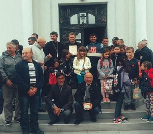 Group of people standing against wall