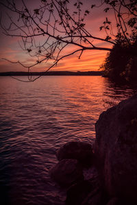 Scenic view of sea against orange sky