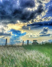 Scenic view of landscape against cloudy sky