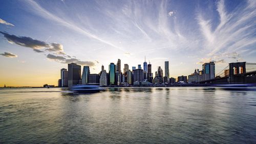 Panoramic view of sea and buildings against sky