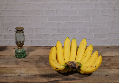 Directly above shot of fruits on table against wall