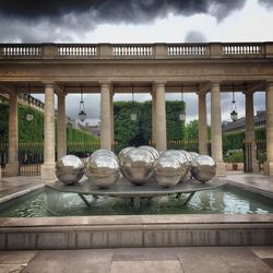 View of statues against cloudy sky