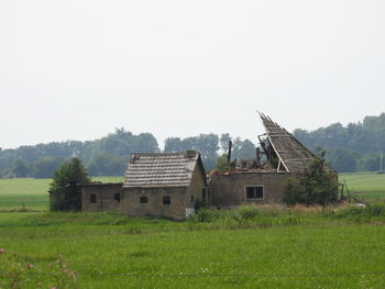 House on grassy field