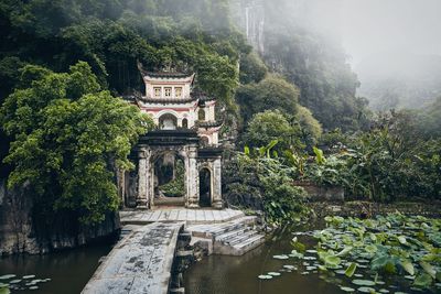 Built structure with trees in the lake