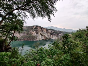 Scenic view of lake and trees against sky