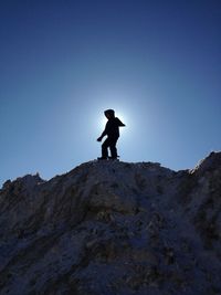 Low angle view of mountain against clear blue sky