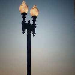 Low angle view of street light against clear sky