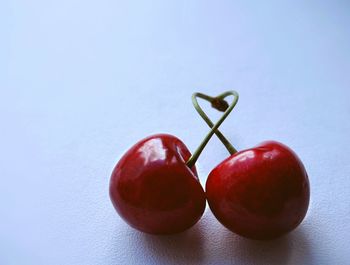 Close-up of cherries on white background