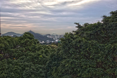 Scenic view of mountains against cloudy sky