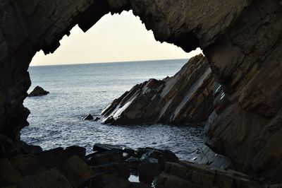 View of sea through cave
