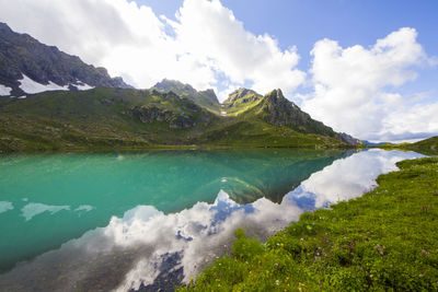 Alpine mountain lake landscape and view, blue beautiful and amazing lake panorama