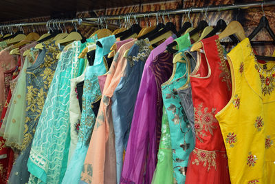 Multi colored dresses hanging for sale in store