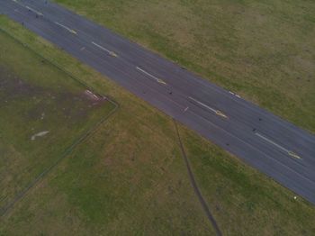 High angle view of tire track on field