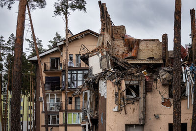 Cities of ukraine after the russian occupation. houses that burned down after being hit by rockets.