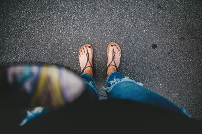 Low section of woman standing outdoors