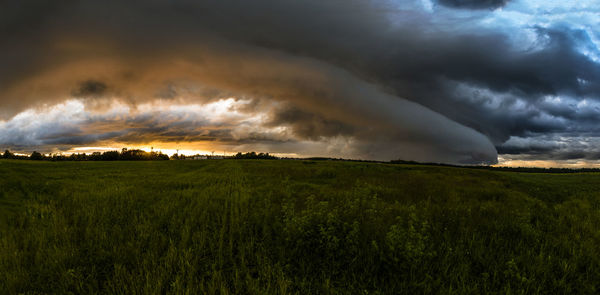 Scenic view of dramatic sky over land