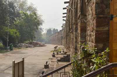 Street amidst buildings against clear sky