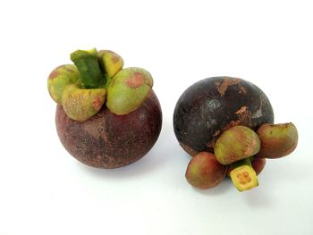 The mangosteen fruits on the white background