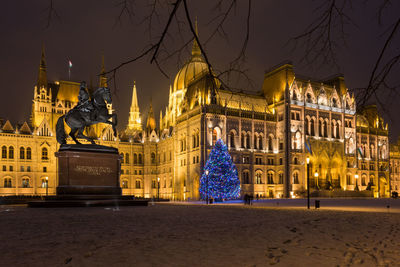 Illuminated hungarian parliament building during christmas