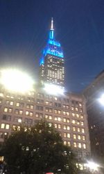 Low angle view of modern building at night