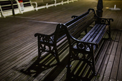 High angle view of empty bench in park