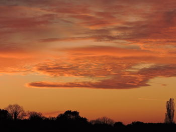 Low angle view of dramatic sky during sunset