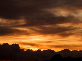 Low angle view of dramatic sky during sunset