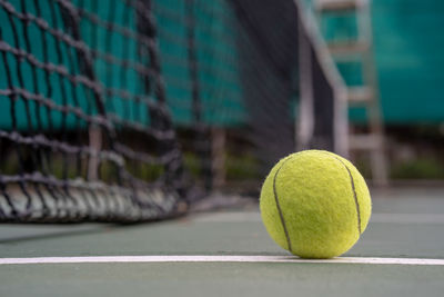 Close-up of tennis ball on court