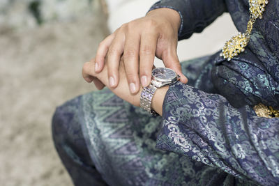 Close-up of woman holding hands