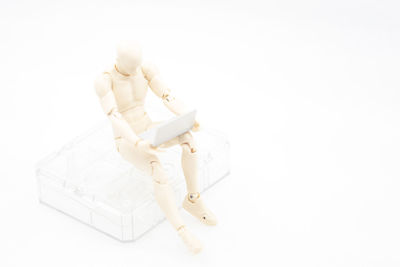 High angle view of stuffed toy against white background