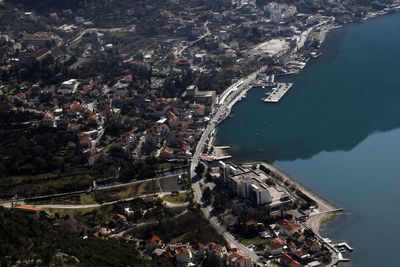 High angle view of townscape by sea