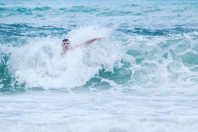 Man surfing in sea