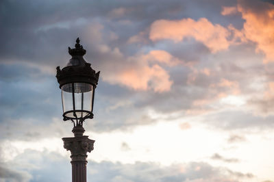 Low angle view of street light against sky