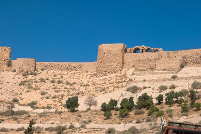 View of fort against blue sky