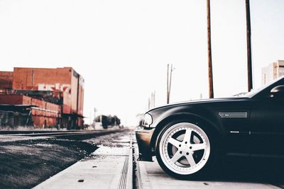 Close-up of car against clear sky