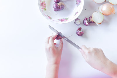 High angle view of woman hand over white background