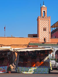 Low angle view of building against clear blue sky