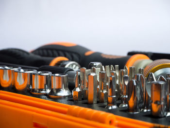 Close-up of drill bits against white background