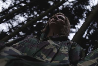Low angle view of woman looking up