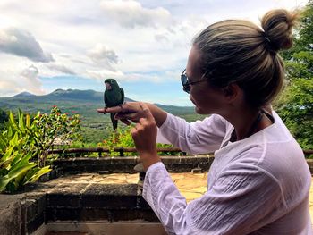 Side view of girl against sky