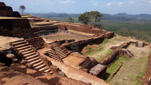 High angle view of old ruins against sky